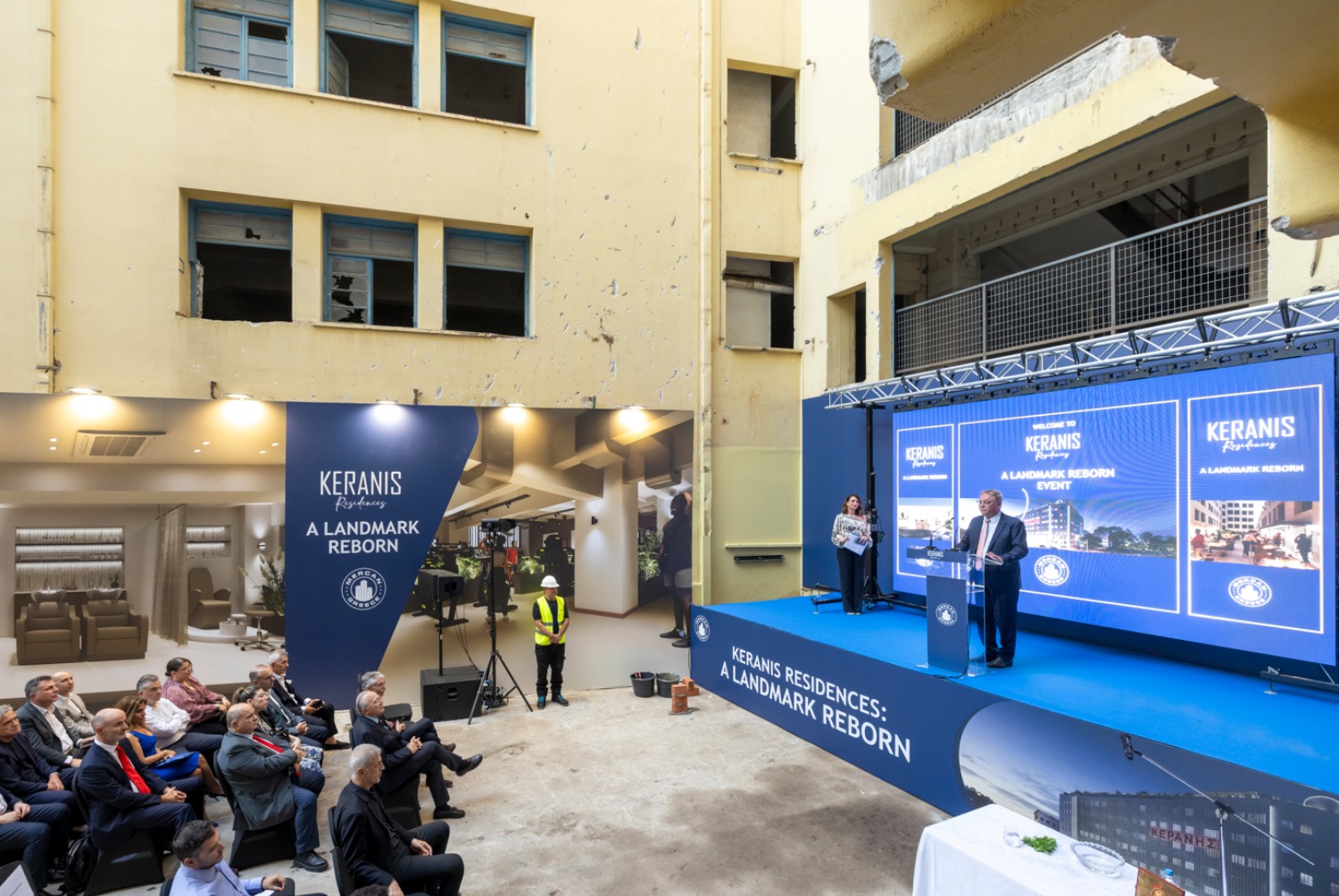 Guests attending the Keranis Residences: A Landmark Reborn event in the courtyard of the Keranis building, Piraeus
